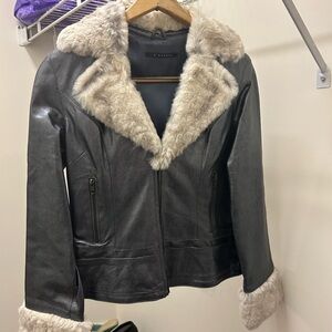 Stunning grey short leather jacket with fur collar and cuffs.